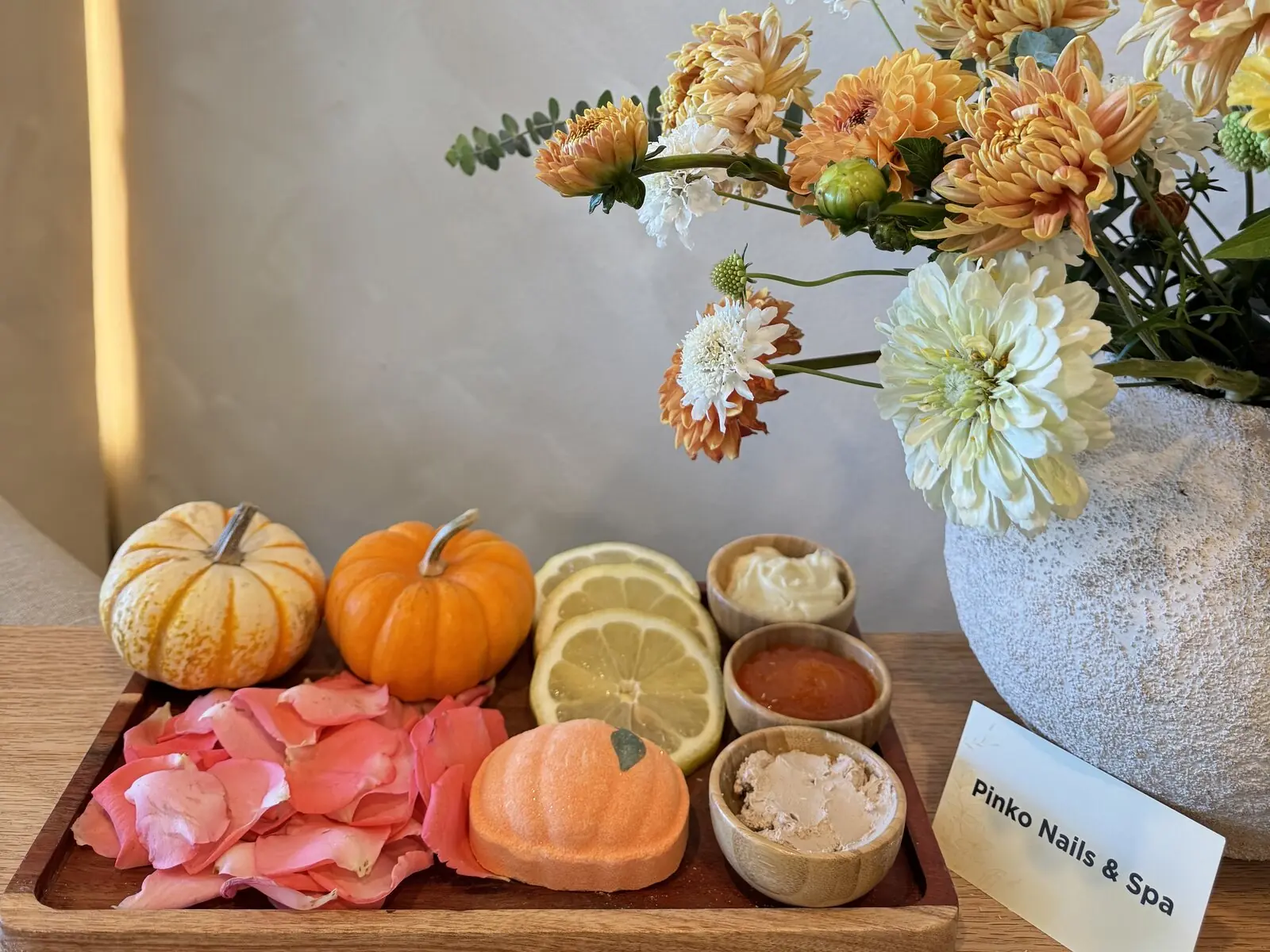 Pumpkin Spice Pedicure tray with mini pumpkins, lemon and pumpkin scrub at Pinko Nails & Spa