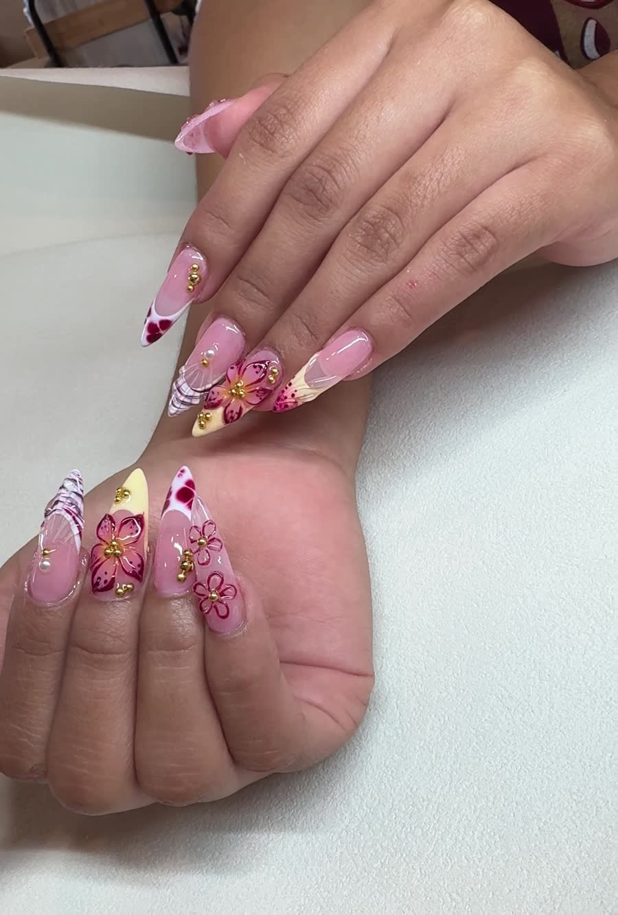 Pink floral nail design close-up